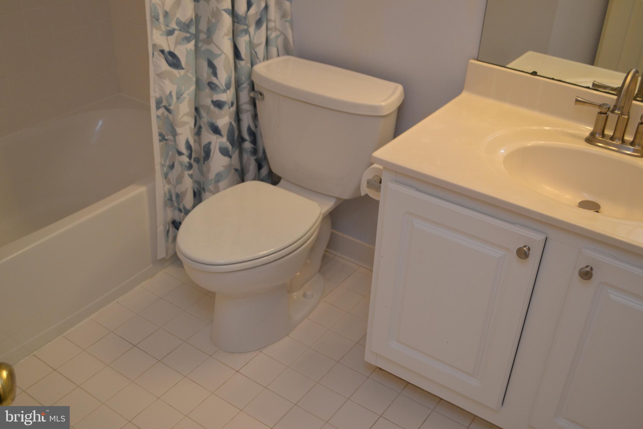 2202 Garden Lane Frederick, MD 21701 - Photo 40 of 50 a white toilet sitting next to a bathroom sink