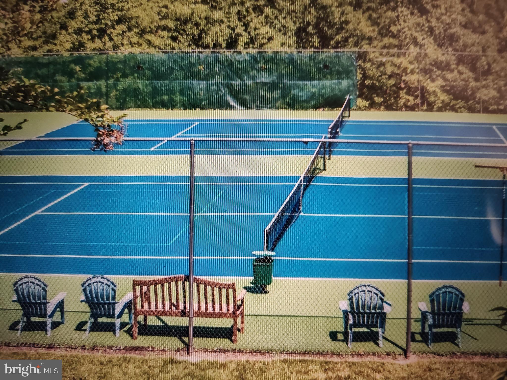 2202 Garden Lane Frederick, MD 21701 - Photo 47 of 50 a view of roof deck with a bench and wooden floor