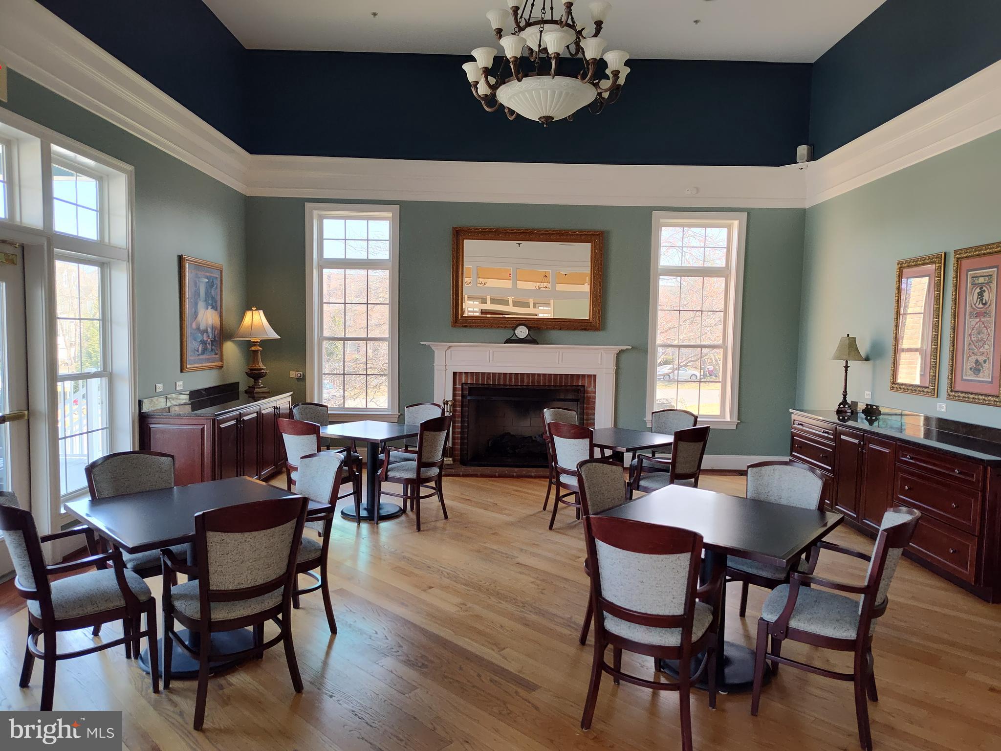 2202 Garden Lane Frederick, MD 21701 - Photo 48 of 50 a living room with furniture a fireplace and a chandelier