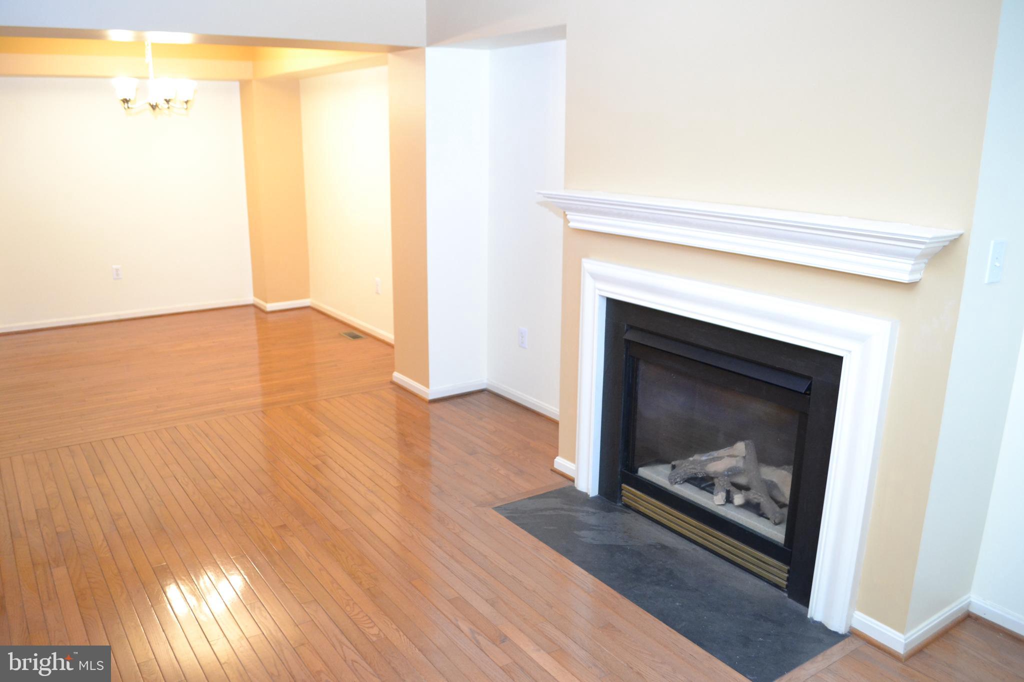 2202 Garden Lane Frederick, MD 21701 - Photo 7 of 50 a living room with a fireplace