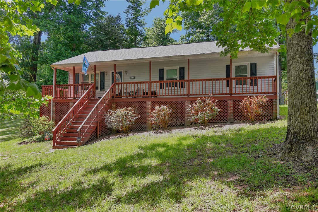 6702 Cherry Road Quinton, VA 23141 - Photo 1 of 20 a view of a house with a backyard