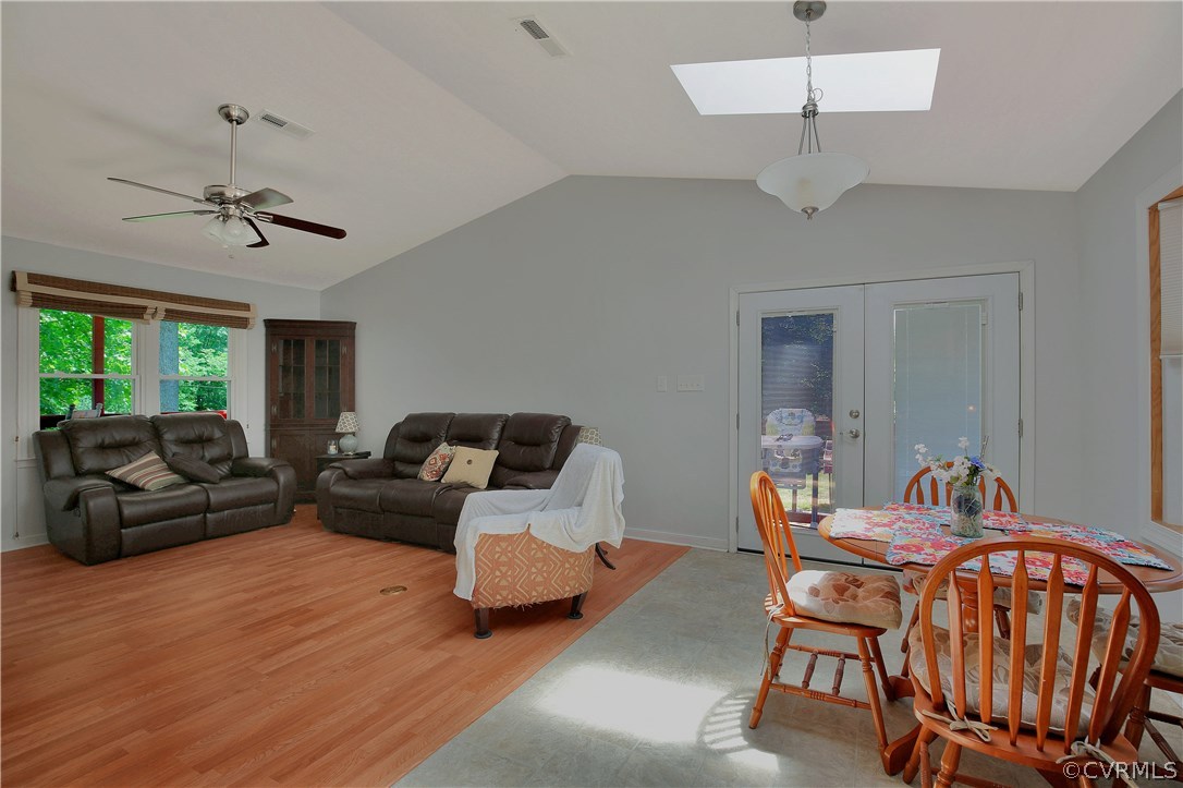 6702 Cherry Road Quinton, VA 23141 - Photo 8 of 20 a living room with furniture a chandelier and a window