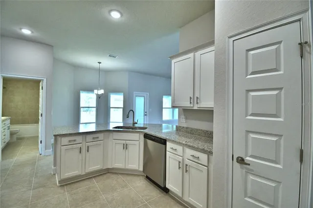 an empty room with a empty space and windows