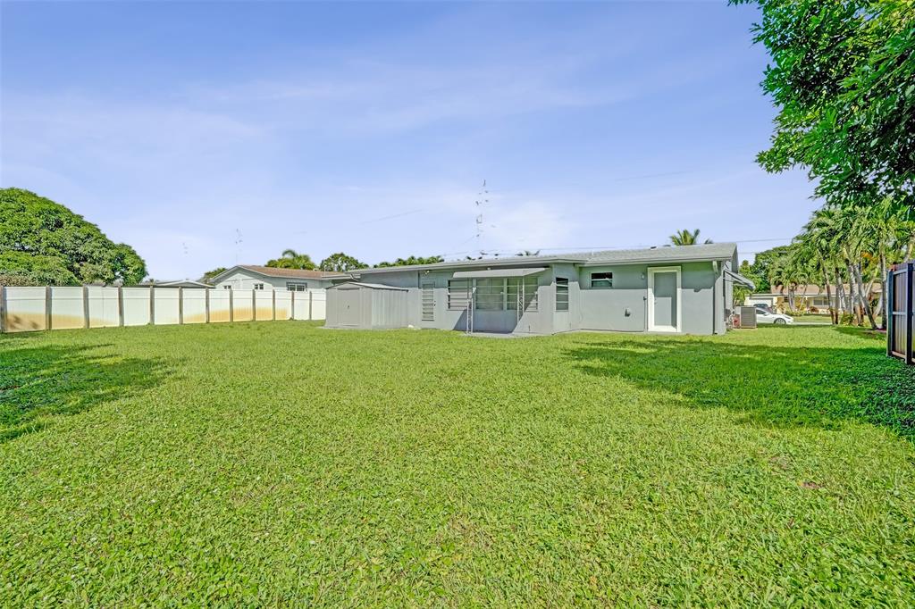 4738 Northwest 5th Street Plantation, FL 33317 - Photo 11 of 68 a view of a big house with a big yard