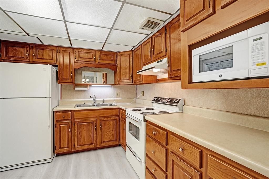 4738 Northwest 5th Street Plantation, FL 33317 - Photo 32 of 68 a kitchen with stainless steel appliances granite countertop a stove a sink dishwasher and a refrigerator