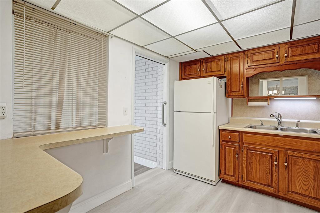 4738 Northwest 5th Street Plantation, FL 33317 - Photo 33 of 68 a kitchen with stainless steel appliances granite countertop a refrigerator and a sink