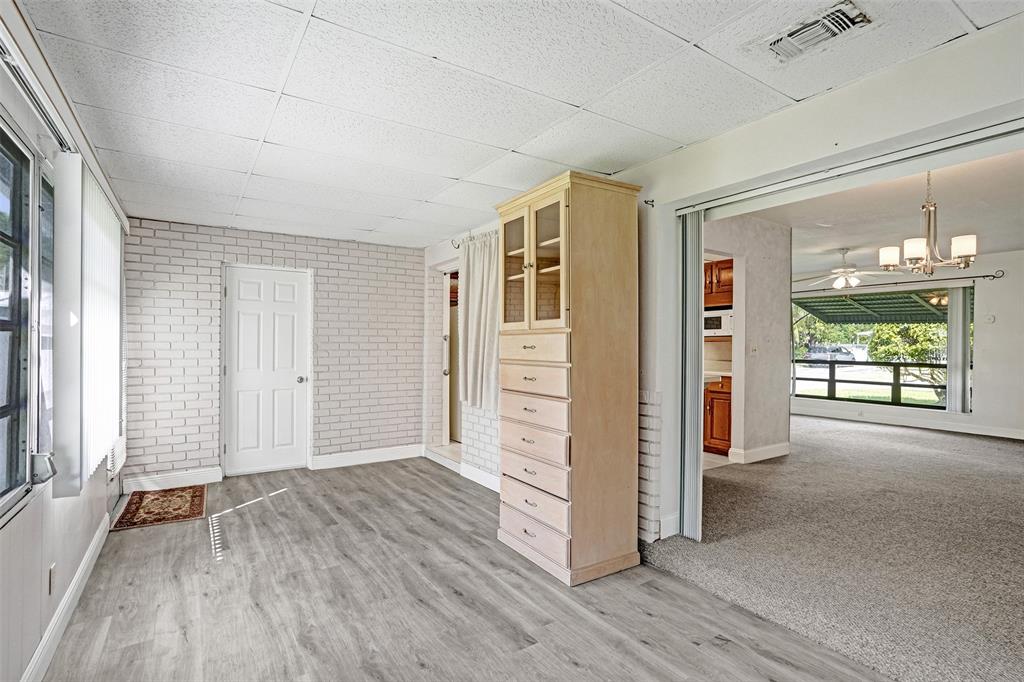 4738 Northwest 5th Street Plantation, FL 33317 - Photo 40 of 68 an empty room with wooden floor and windows