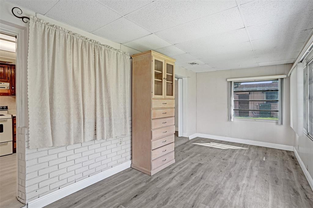 4738 Northwest 5th Street Plantation, FL 33317 - Photo 43 of 68 an empty room with wooden floor closet and windows