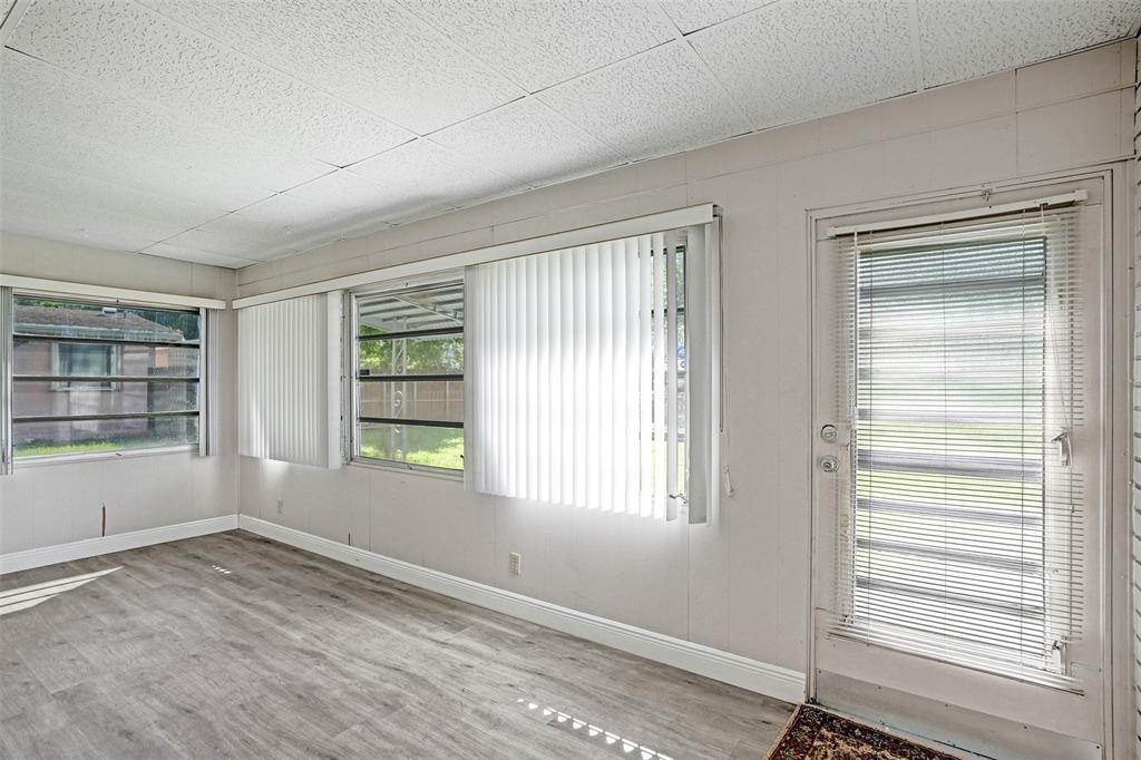 4738 Northwest 5th Street Plantation, FL 33317 - Photo 44 of 68 a view of an empty room with wooden floor and a window