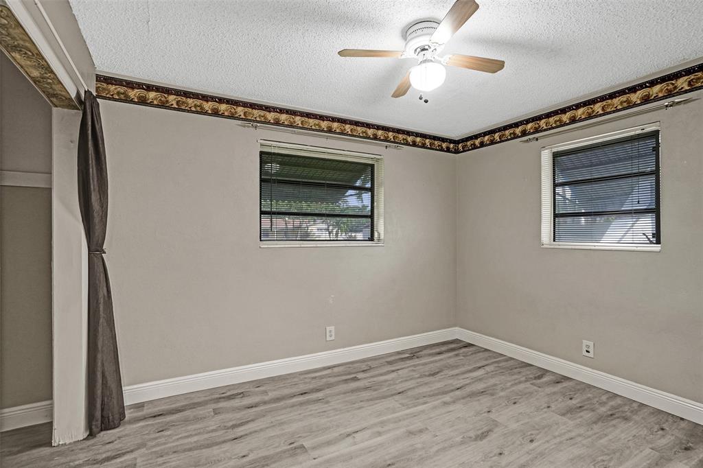 4738 Northwest 5th Street Plantation, FL 33317 - Photo 49 of 68 a view of empty room with wooden floor and fan