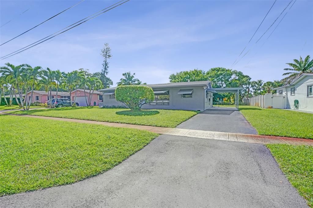 4738 Northwest 5th Street Plantation, FL 33317 - Photo 5 of 68 a house view with a garden space