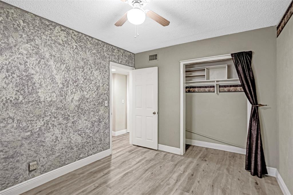 4738 Northwest 5th Street Plantation, FL 33317 - Photo 51 of 68 an empty room with wooden floor and a ceiling fan