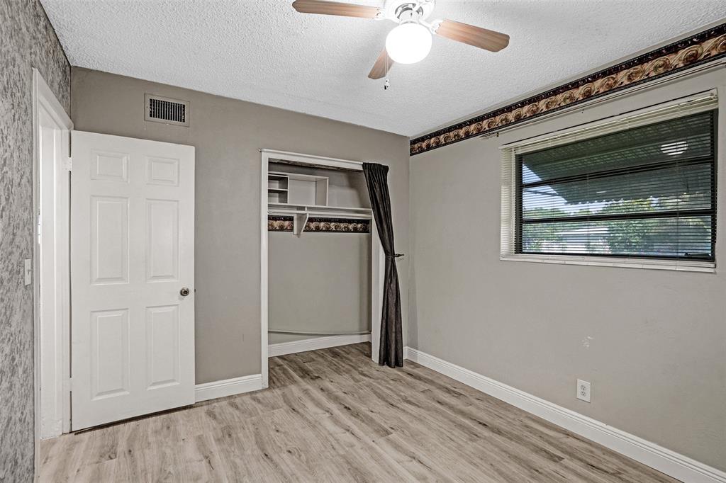 4738 Northwest 5th Street Plantation, FL 33317 - Photo 53 of 68 a view of an empty room with wooden floor and a window