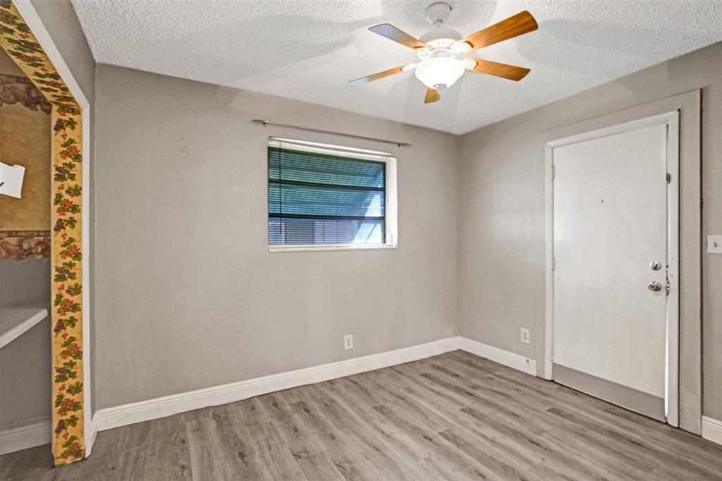 4738 Northwest 5th Street Plantation, FL 33317 - Photo 56 of 68 a view of empty room with wooden floor and fan
