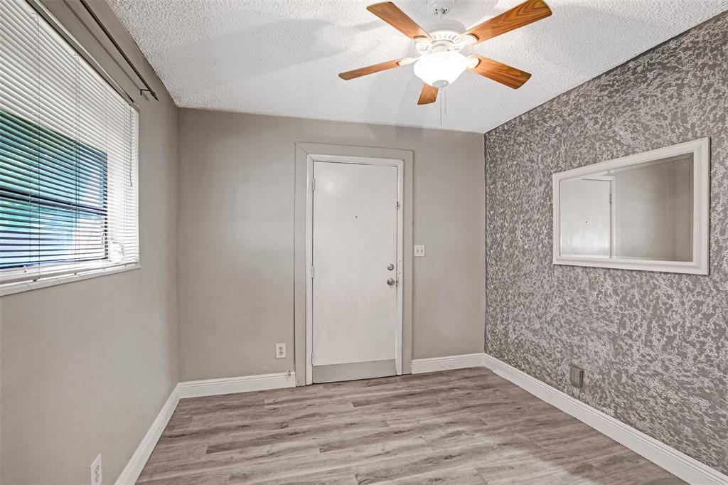 4738 Northwest 5th Street Plantation, FL 33317 - Photo 57 of 68 a view of an empty room with wooden floor and a window