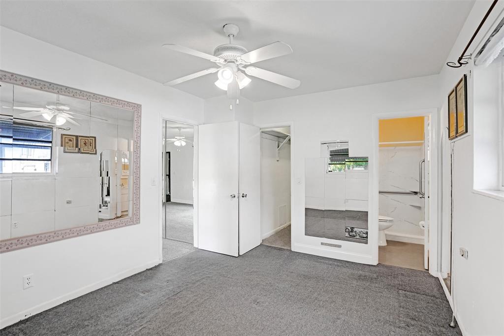 4738 Northwest 5th Street Plantation, FL 33317 - Photo 62 of 68 a view of a livingroom with a chandelier fan and a fireplace