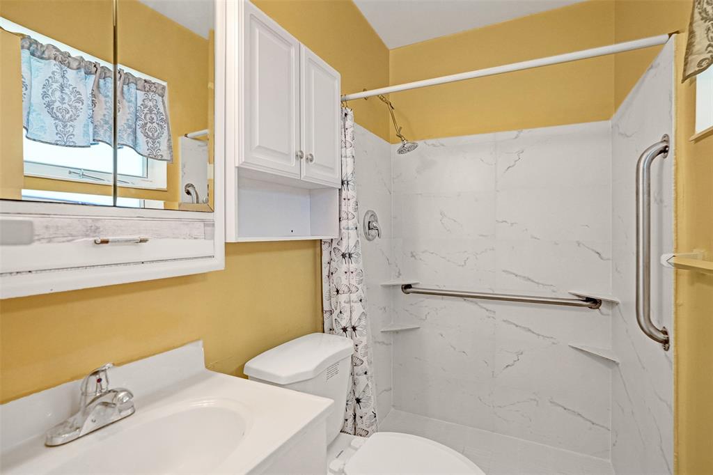 4738 Northwest 5th Street Plantation, FL 33317 - Photo 67 of 68 a bathroom with a sink and a mirror