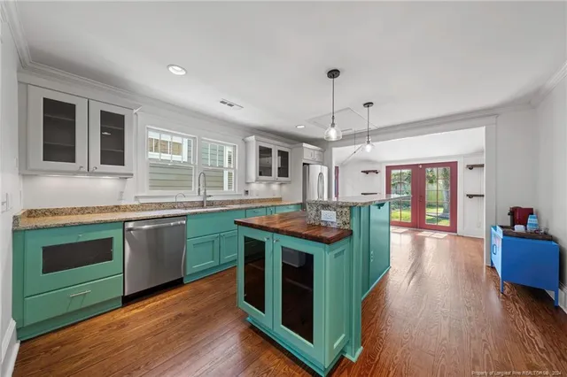 a kitchen with lots of counter space and a refrigerator