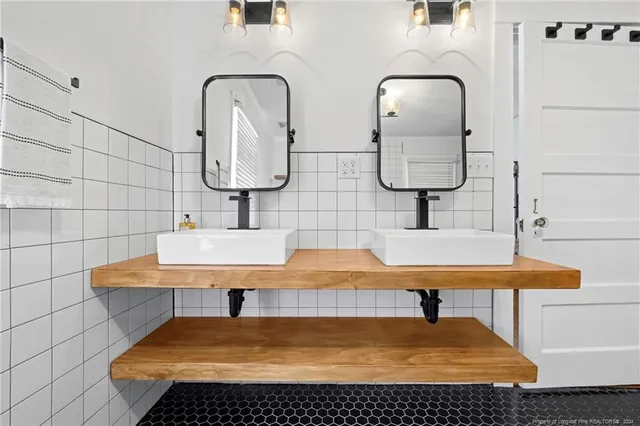 a bathroom with a bathtub and shower