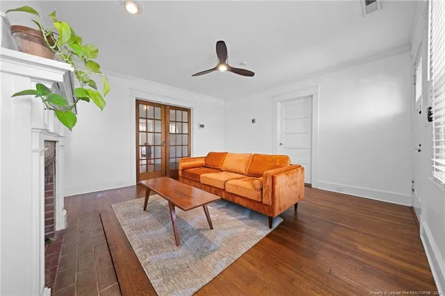 a living room with furniture and a fireplace