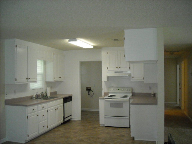 5899 Mt Pleasant Church Road Macon, GA 31216 - Photo 2 of 11 a kitchen with cabinets stainless steel appliances and a counter space