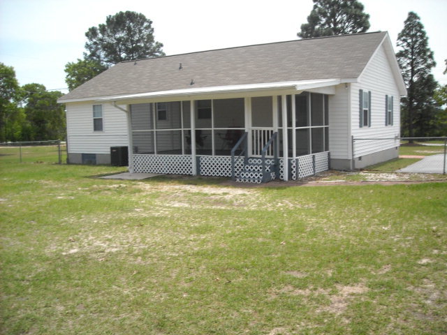 5899 Mt Pleasant Church Road Macon, GA 31216 - Photo 5 of 11 a view of a house with a yard and sitting area