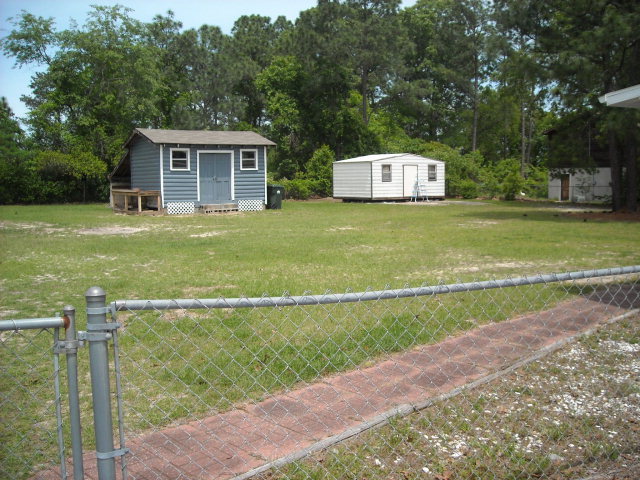 5899 Mt Pleasant Church Road Macon, GA 31216 - Photo 9 of 11 a front view of a house with a yard