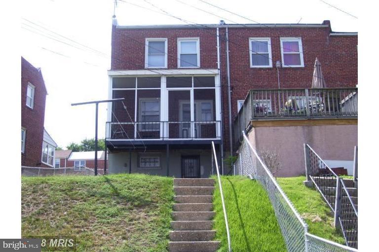 515 Roundview Road Brooklyn, MD 21225 - Photo 13 of 14 a front view of a house with a yard