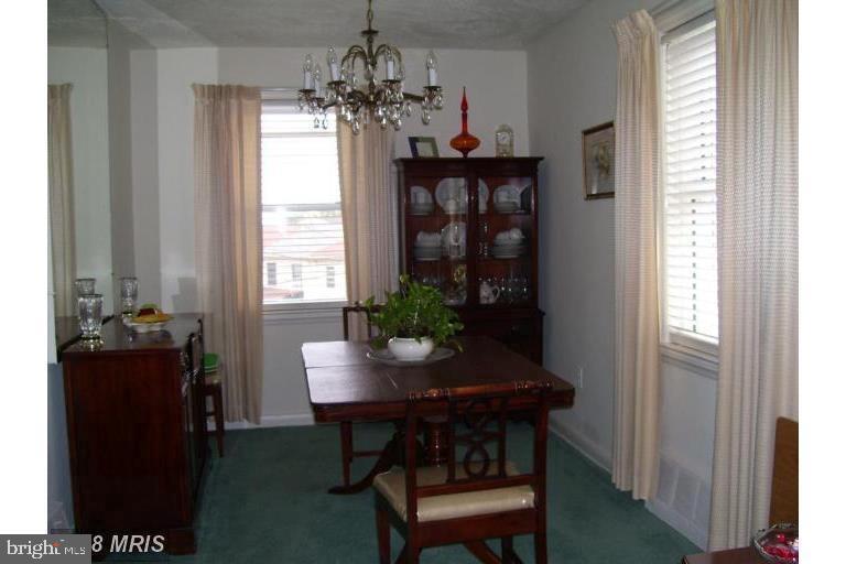 515 Roundview Road Brooklyn, MD 21225 - Photo 4 of 14 a dining room with furniture and window