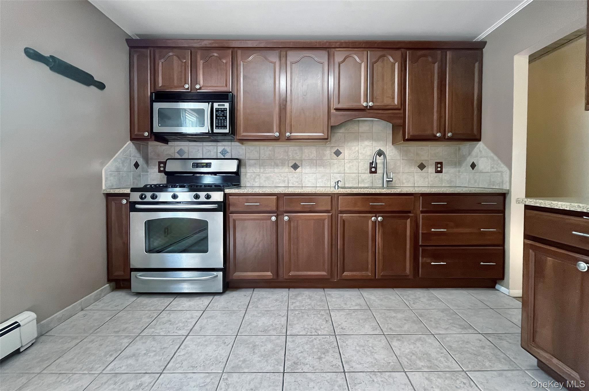 554 High Street Monroe, NY 10950 - Photo 14 of 29 a kitchen with a stove and a sink