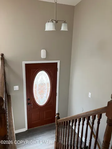 a view of a hallway with washer and dryer