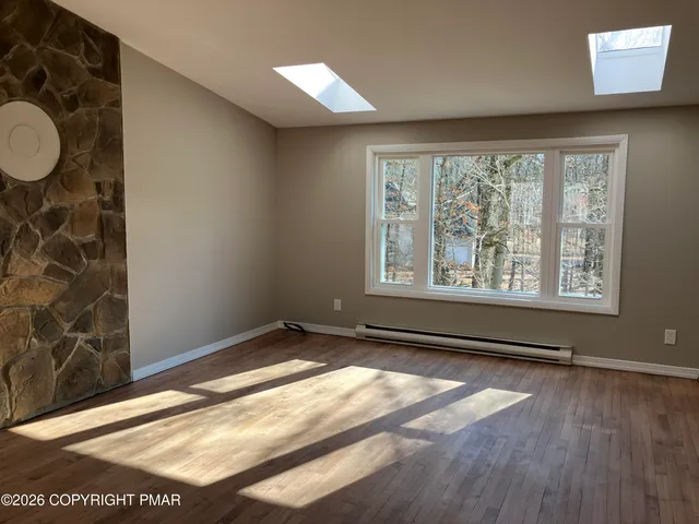 a view of an empty room and window