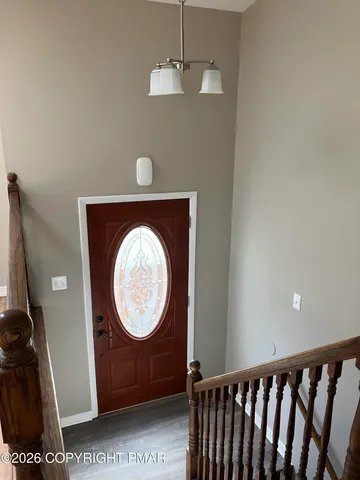 a view of a hallway with washer and dryer