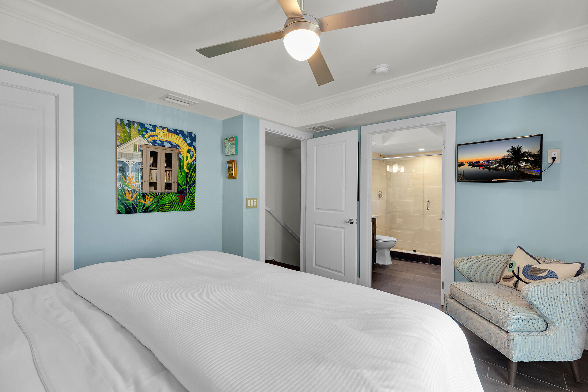 141 Simonton Street Key West, FL 33040 - Photo 21 of 49 a bedroom with a bed and a chandelier