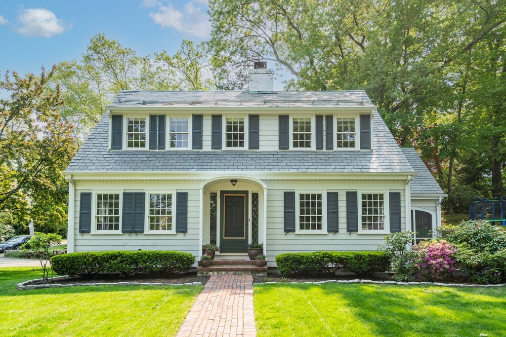176 Dorset Road Newton, MA 02468 - Photo 2 of 27 a front view of a house with a yard and potted plants