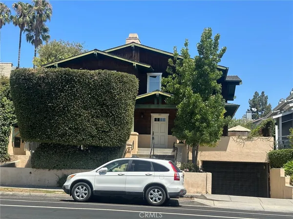 a car parked in front of a house