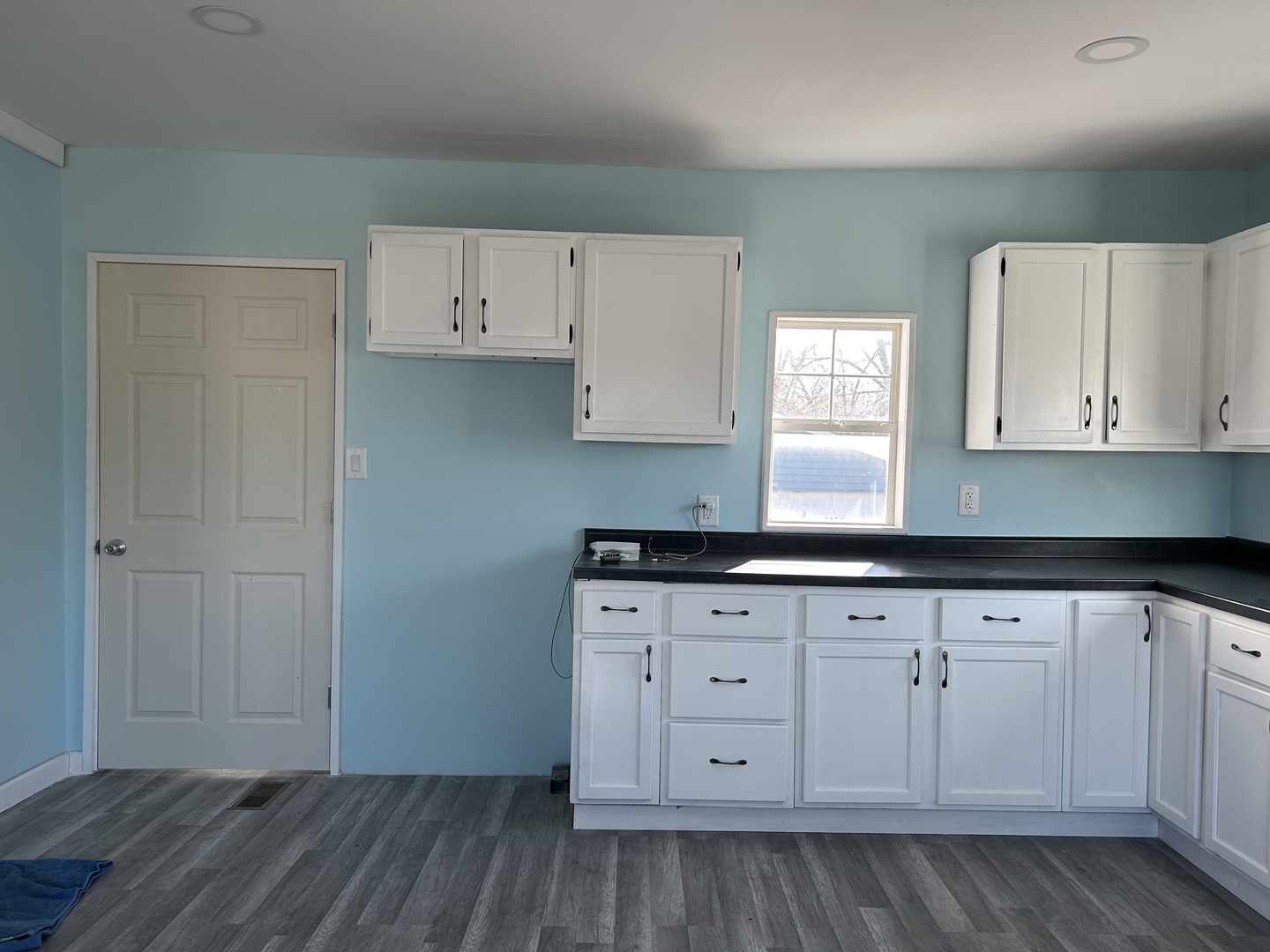 129 West Main Street Amboy, IL 61310 - Photo 16 of 40 a kitchen with granite countertop white cabinets and a stove