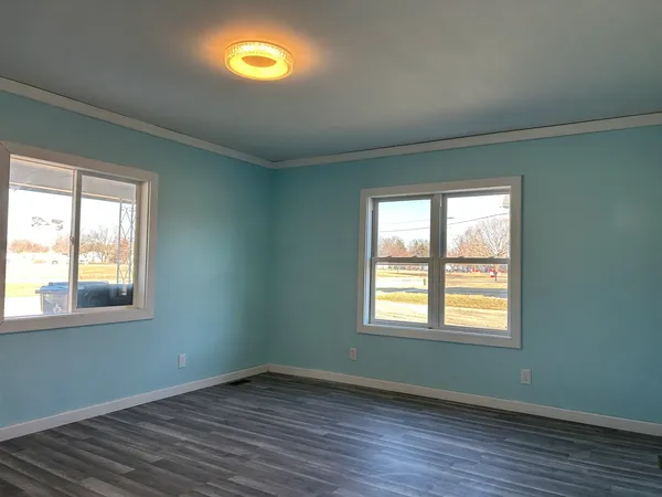 a view of a room with gym equipment and a window