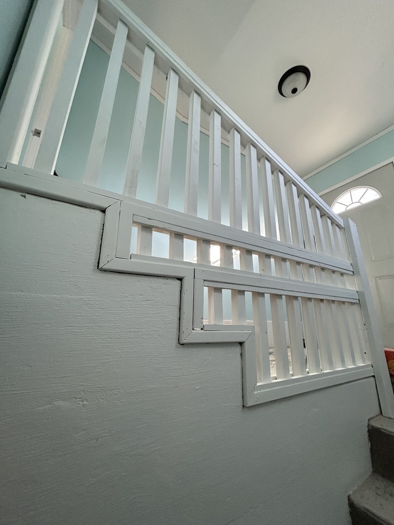 129 West Main Street Amboy, IL 61310 - Photo 32 of 40 a view of staircase with railing and white walls