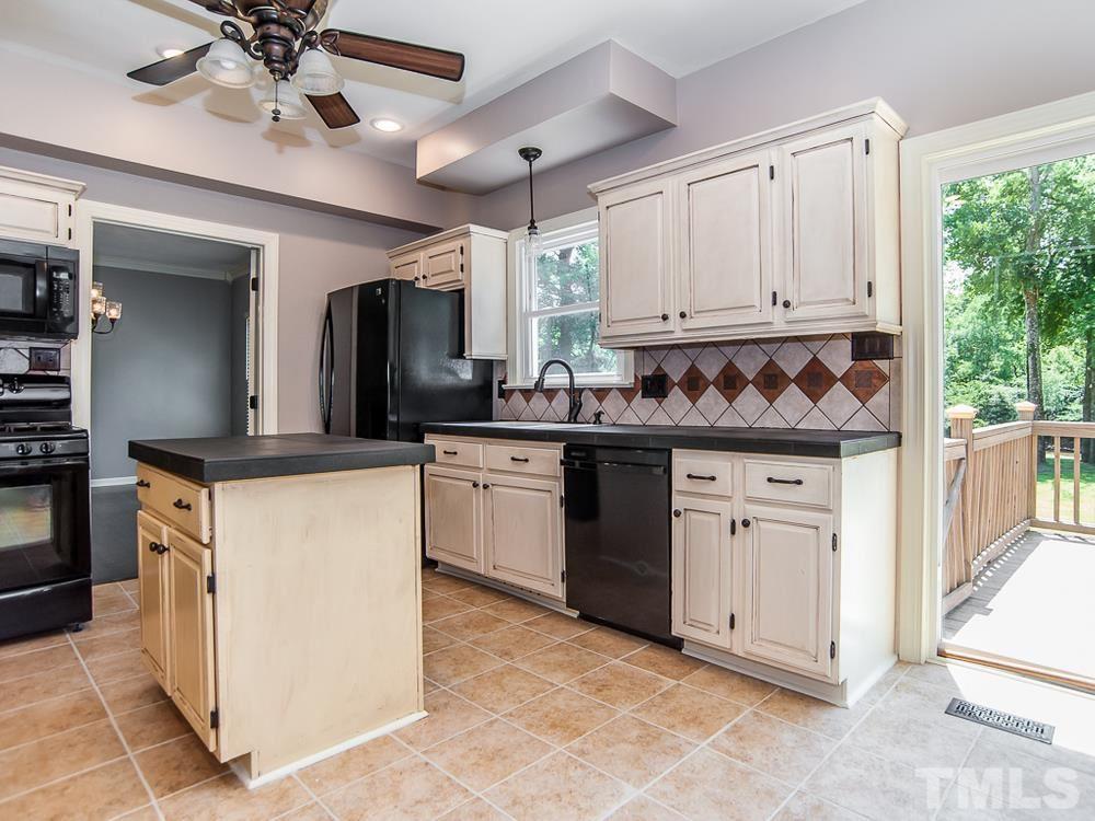 3608 Willow Bluff Drive Raleigh, NC 27604 - Photo 13 of 29 a kitchen with granite countertop a sink stainless steel appliances and cabinets