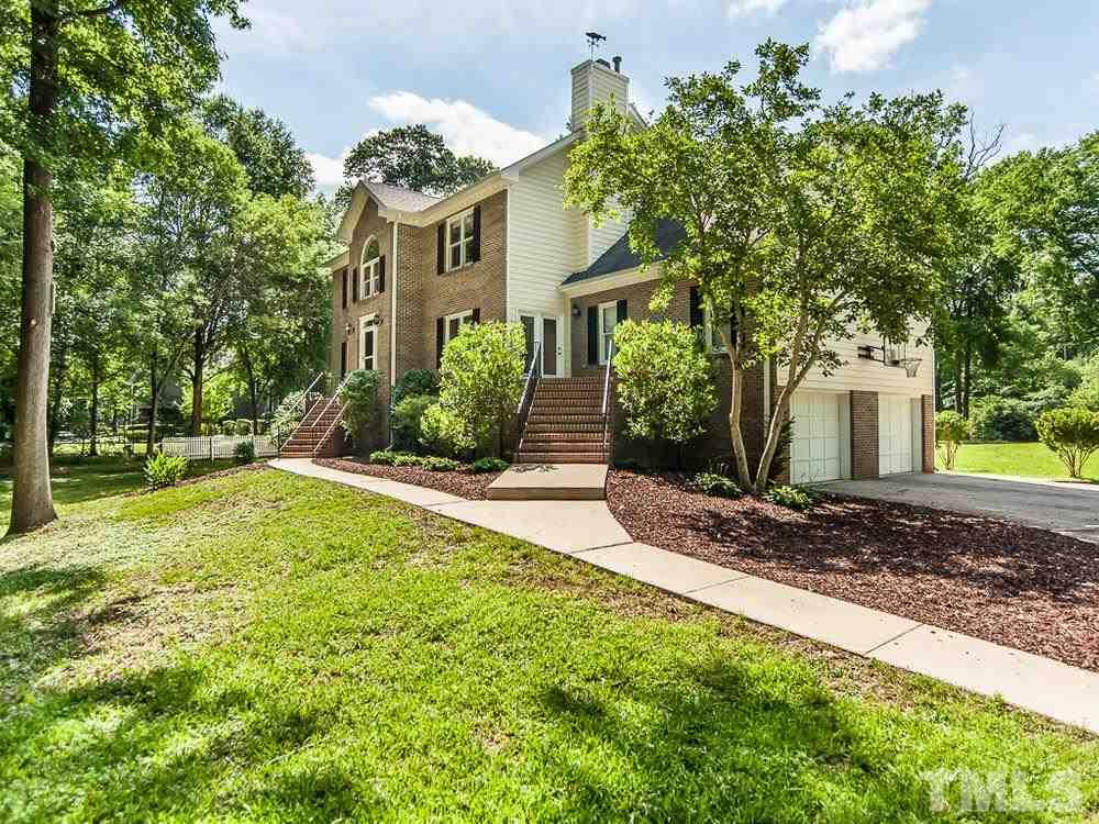 3608 Willow Bluff Drive Raleigh, NC 27604 - Photo 3 of 29 a front view of a house with garden