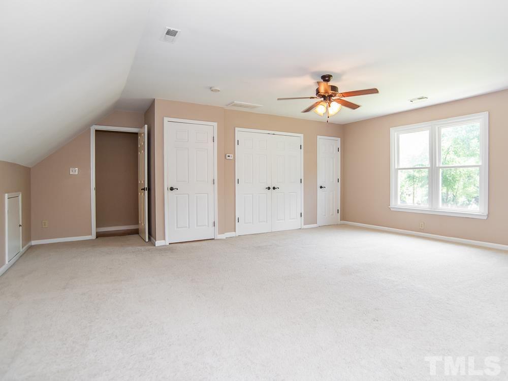 3608 Willow Bluff Drive Raleigh, NC 27604 - Photo 21 of 29 an empty room with a ceiling fan and a window