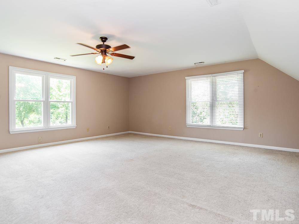 3608 Willow Bluff Drive Raleigh, NC 27604 - Photo 22 of 29 an empty room with windows and fan