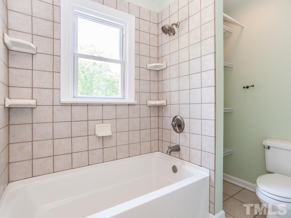3608 Willow Bluff Drive Raleigh, NC 27604 - Photo 23 of 29 a bathroom with a bathtub and window