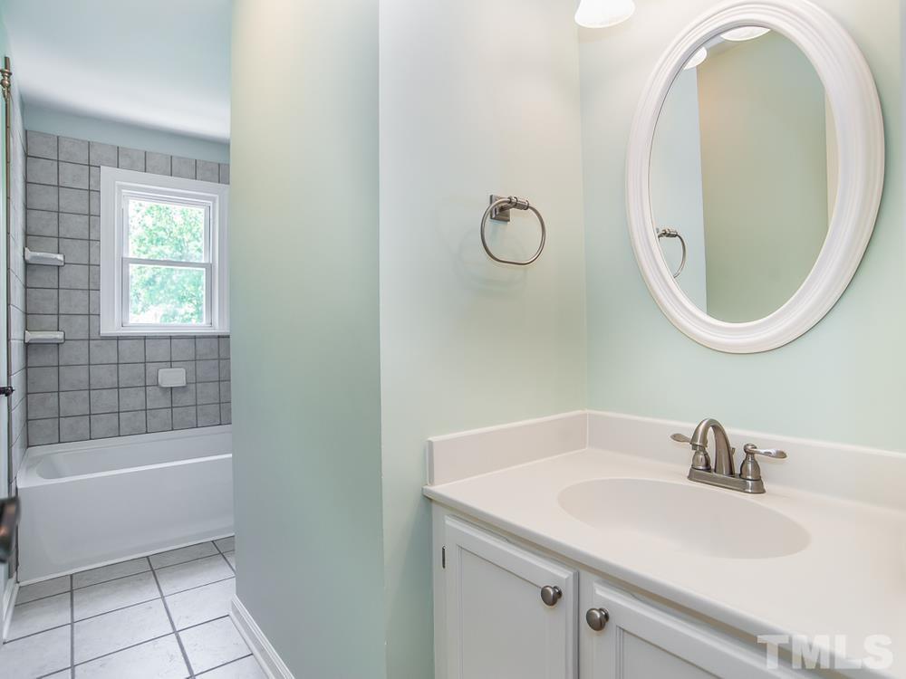3608 Willow Bluff Drive Raleigh, NC 27604 - Photo 24 of 29 a bathroom with a sink and a mirror