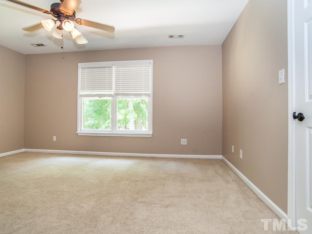 3608 Willow Bluff Drive Raleigh, NC 27604 - Photo 26 of 29 an empty room with a window and a fan