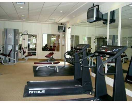 6760 West Sample Road, Unit 6760 Coral Springs, FL 33067 - Photo 4 of 6 a view of a room with gym equipment