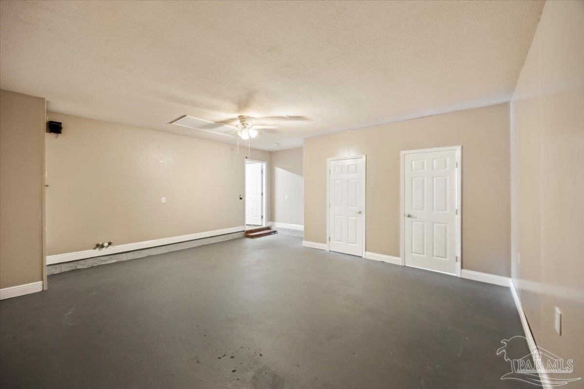 4015 Berry Circle Pace, FL 32571 - Photo 24 of 48 an empty room with a empty space and a ceiling fan