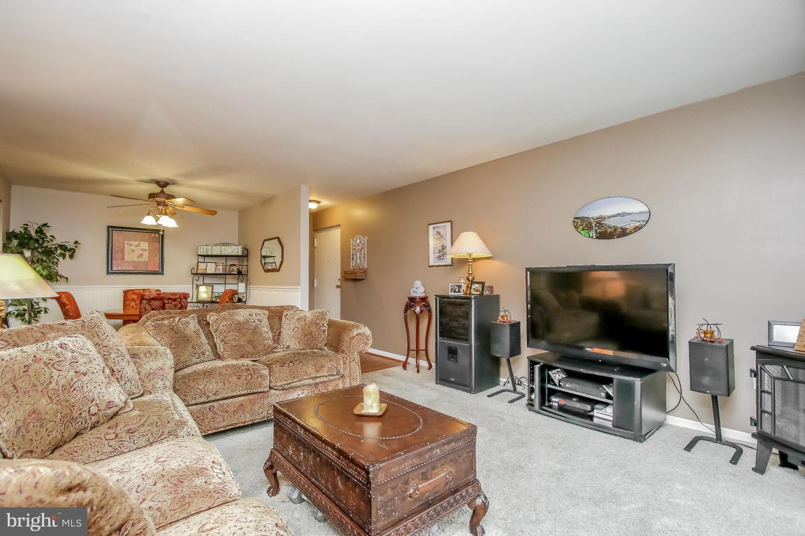 2572 Riva Road, Unit 16B Annapolis, MD 21401 - Photo 3 of 22 a living room with furniture and a flat screen tv