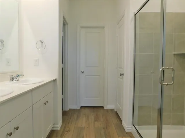 a bathroom with a sink and mirror